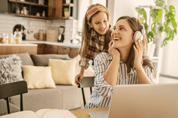 Woman working from home with her child